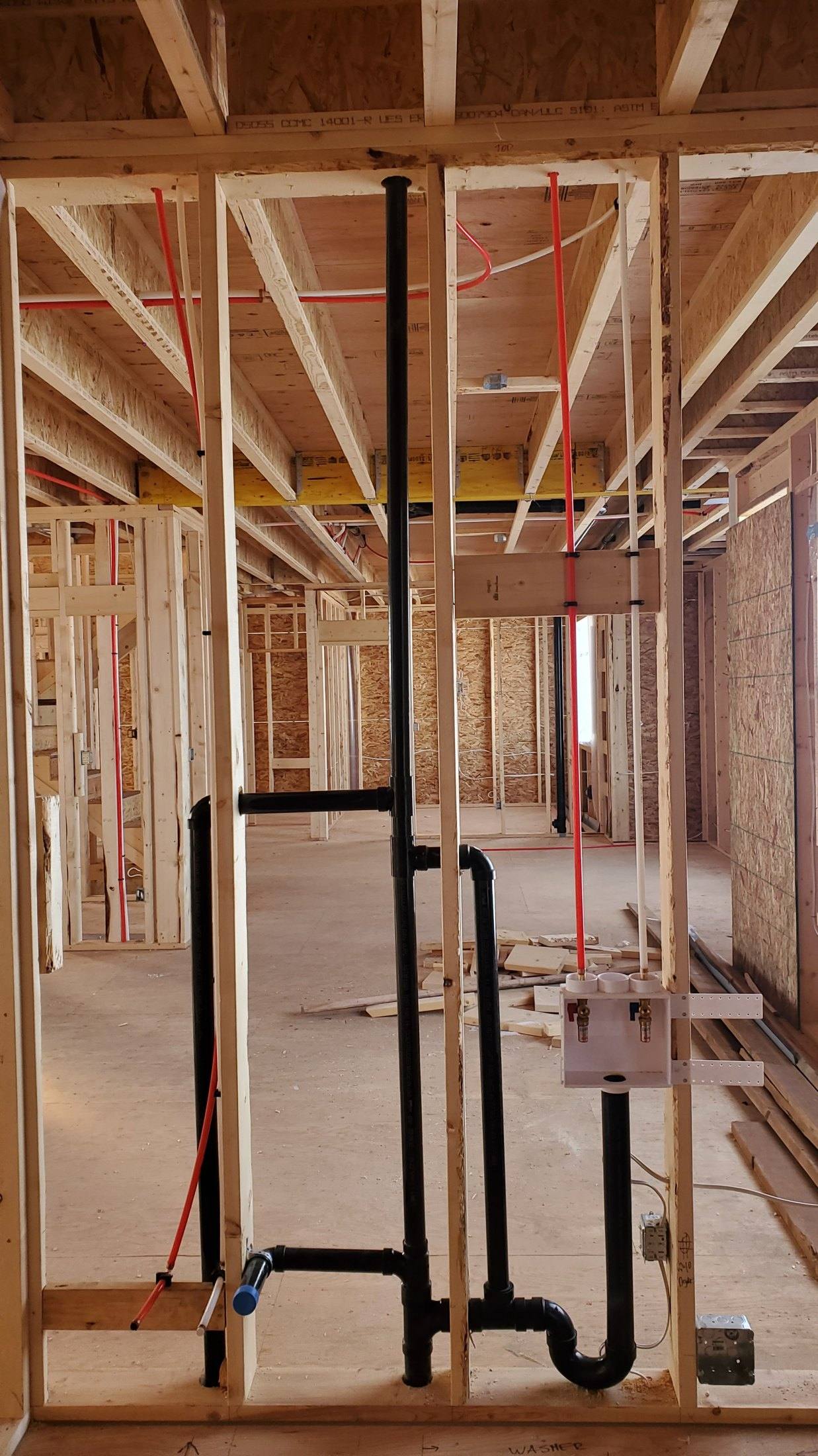 Basement plumbing rough-in by DNB in a Calgary home