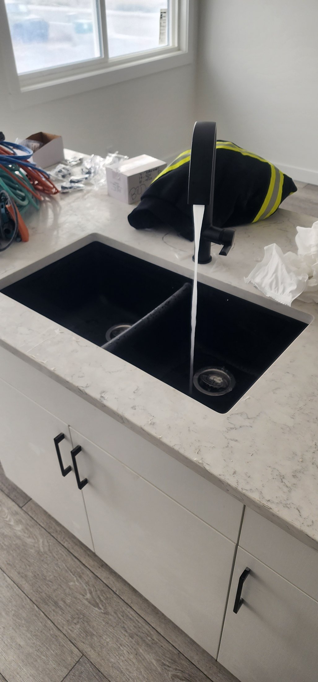 Kitchen plumbing installation in a Calgary home by DNB